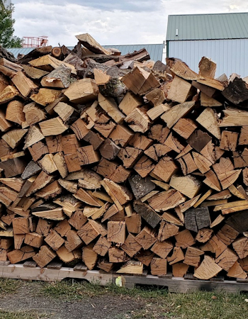 Large stack of firewoodSawmill cutting large white oak