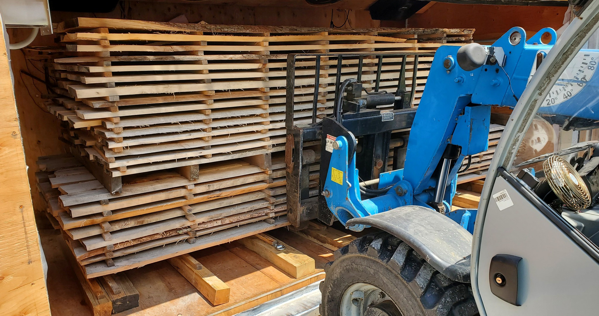 Diller Millworks loading the kiln with stacks of stickered milled wood