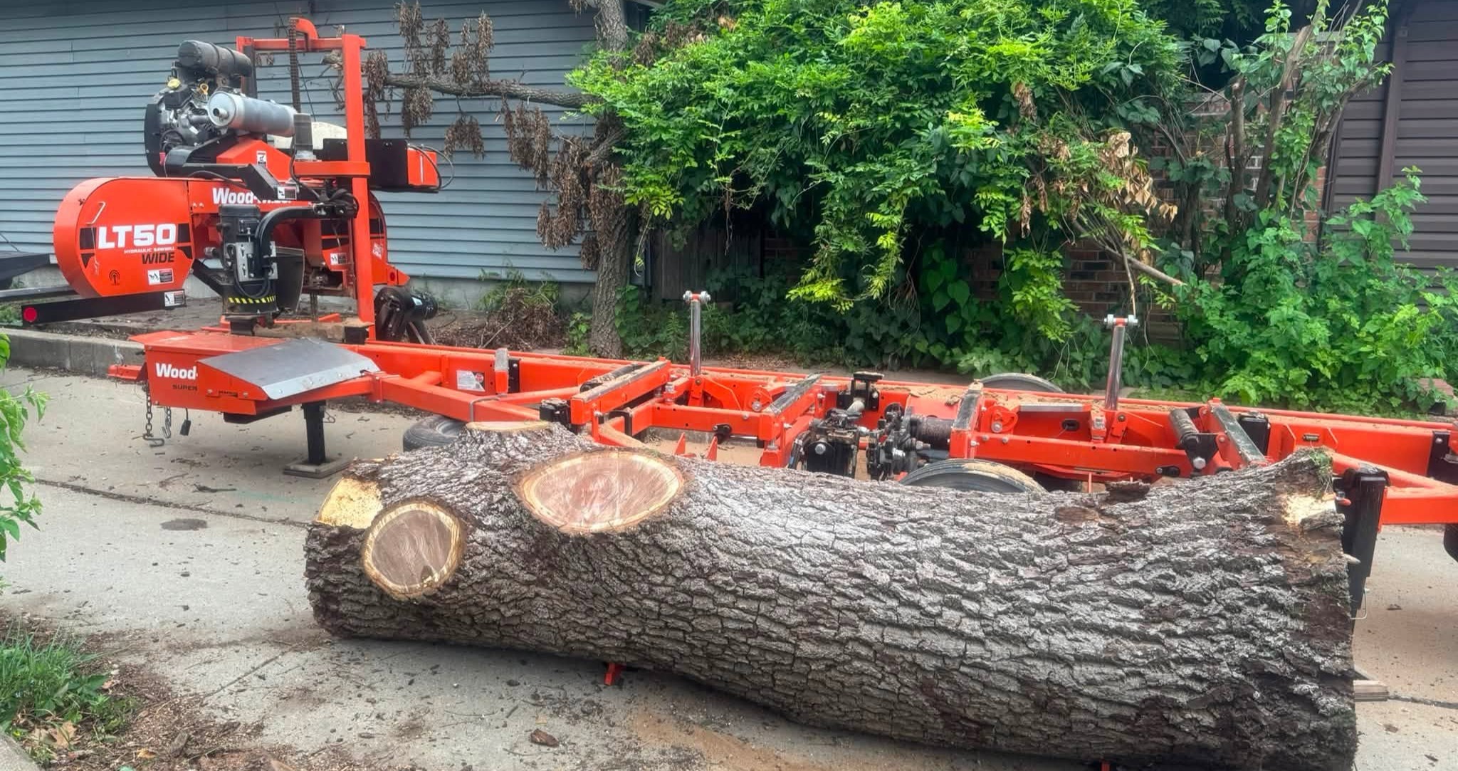 Diller Millworks large white oak log partially cut on the mill